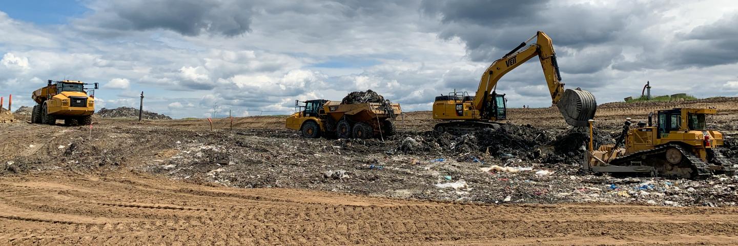 Heavy equipment digging up and removing hazardous waste from the closed WDE landfill in Andover, Minnesota.