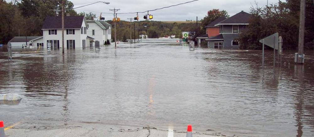 Main street of a small town completely flooded with water. 