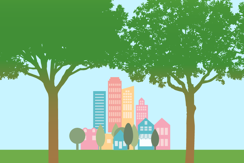 A city skyline is shaded by trees.