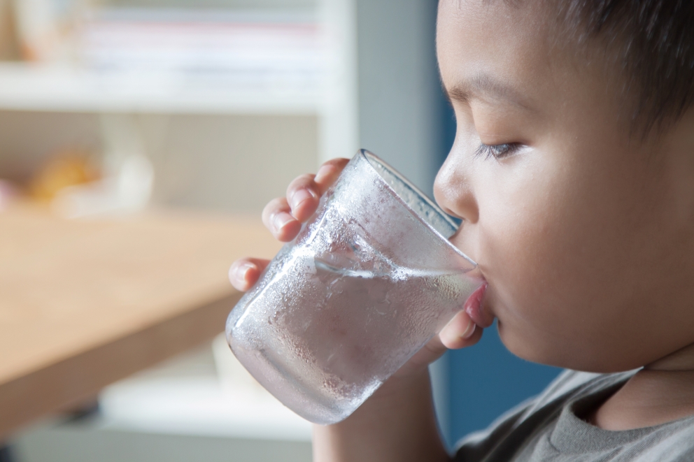 Boy drinking glass of water