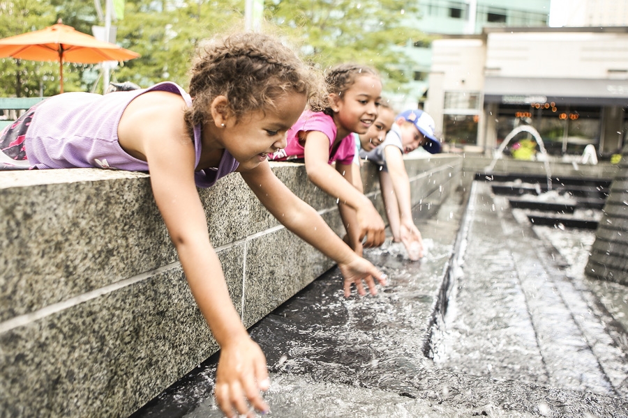 Children playing in a fountain.