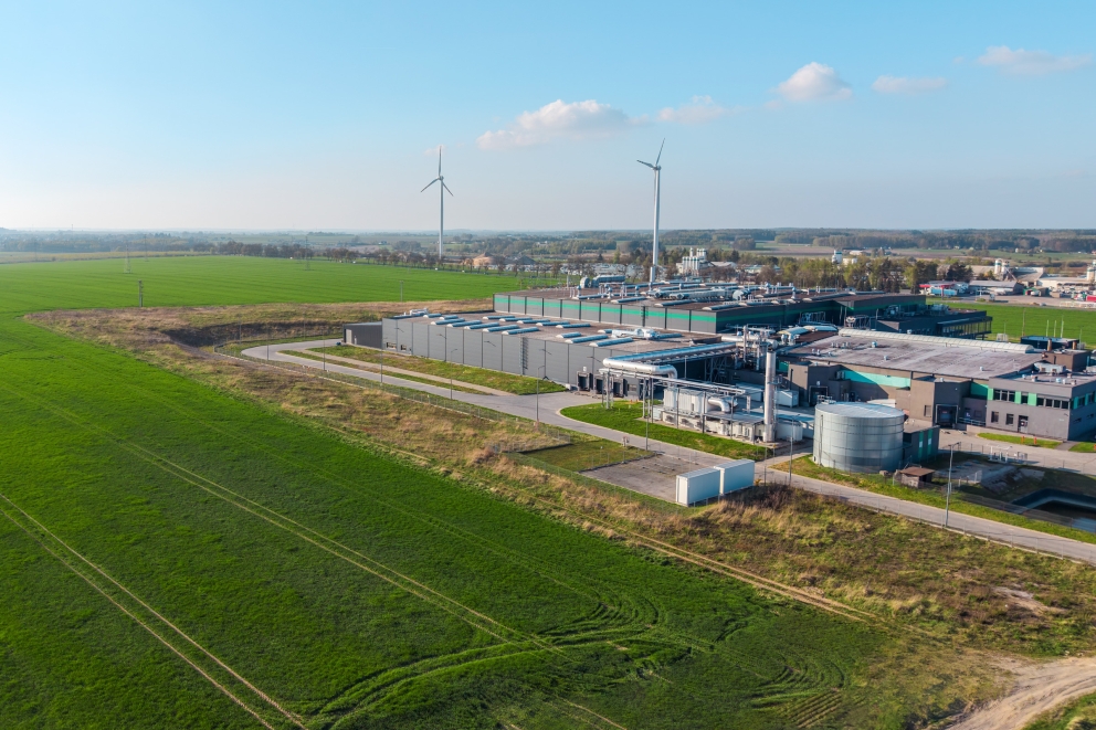 Aerial view of a data center next to a grassy field.