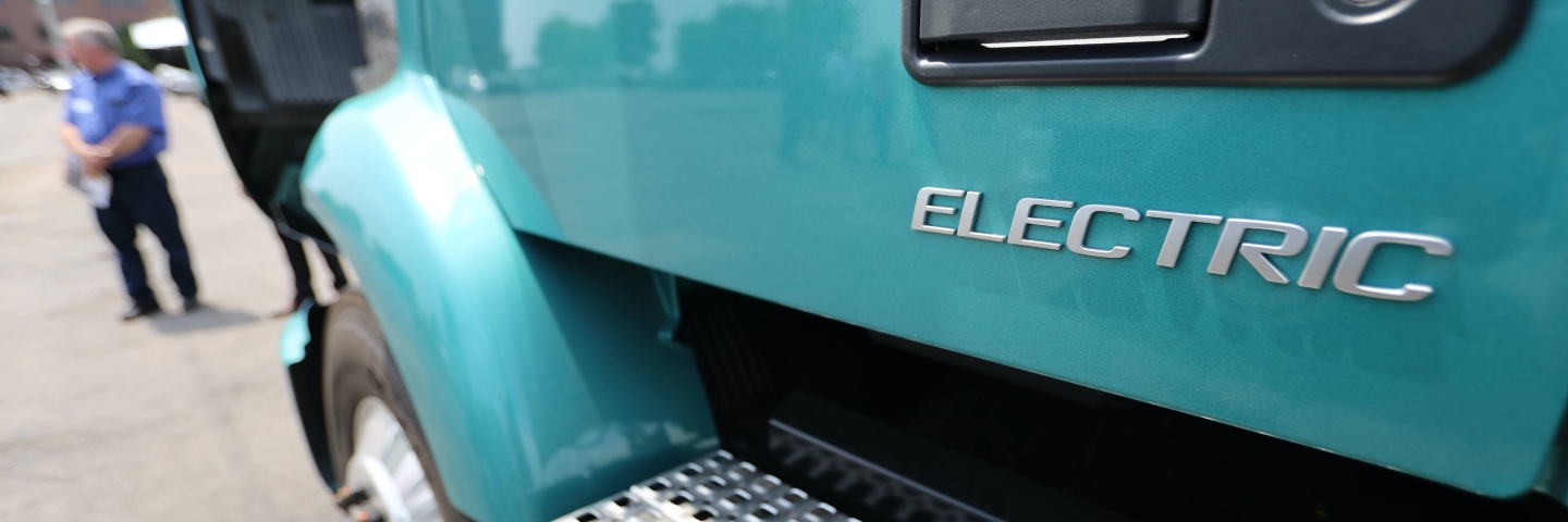 Close up of the word "electric" on the side of a heavy-duty vehicle.