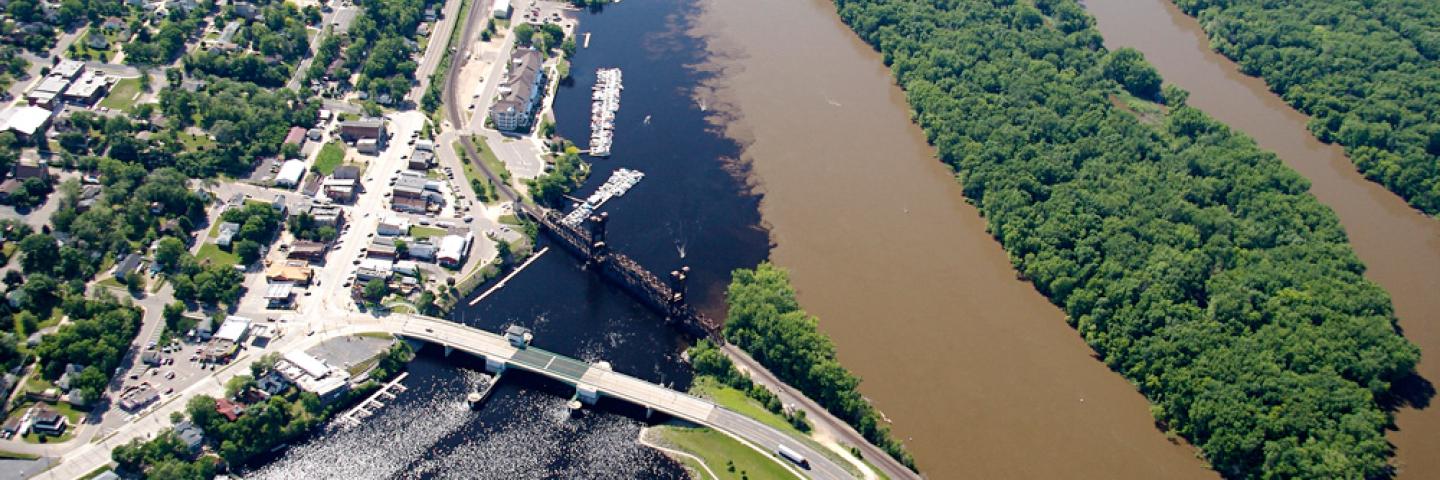 An aerial view showing the clear water of the St Croix River flowing into the muddy water of the Mississippi River