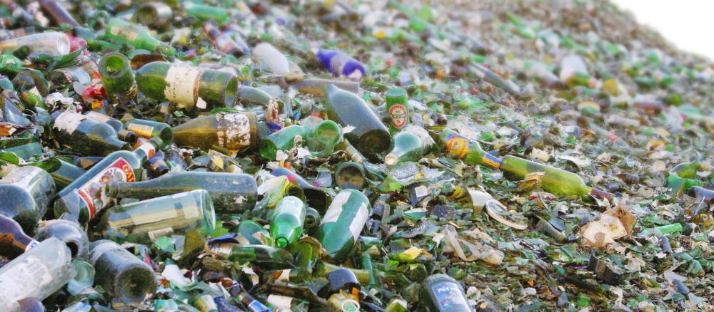 A very large pile of empty glass bottles