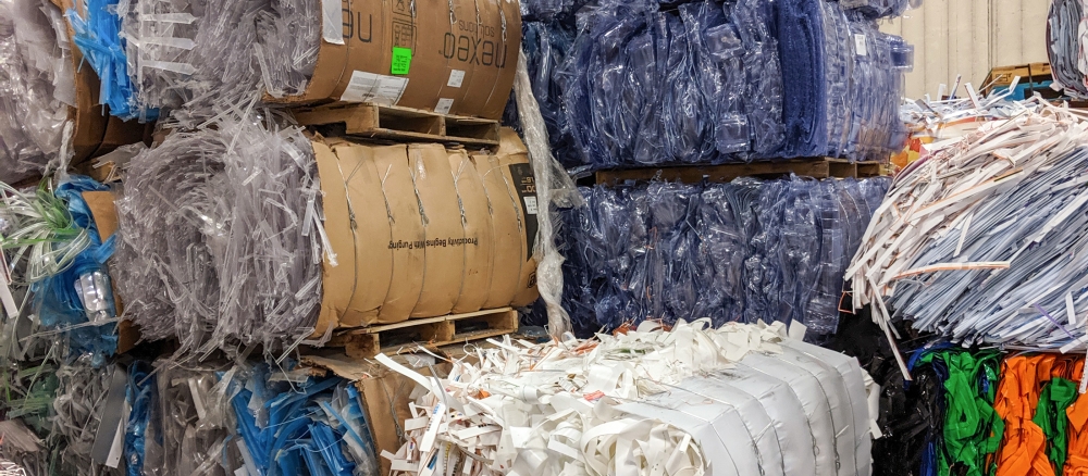 baled polypropylene and PVC to be shipped for recycling