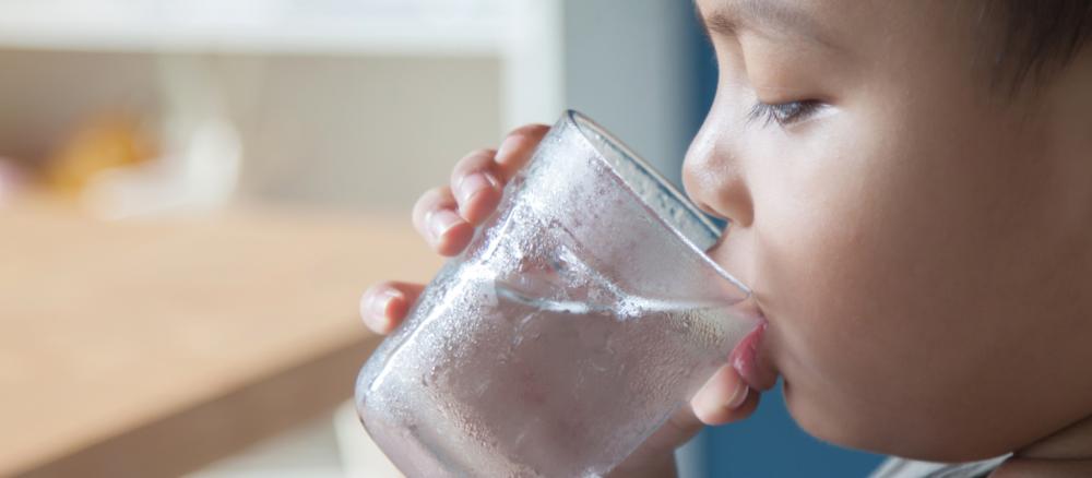 boy drinking glass of water