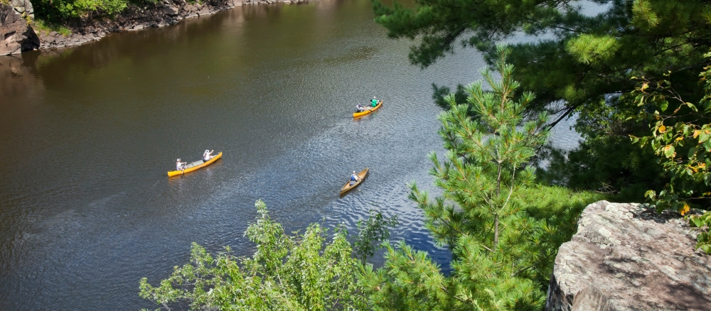 Canoes on the St Croix River viewed from an overlook.