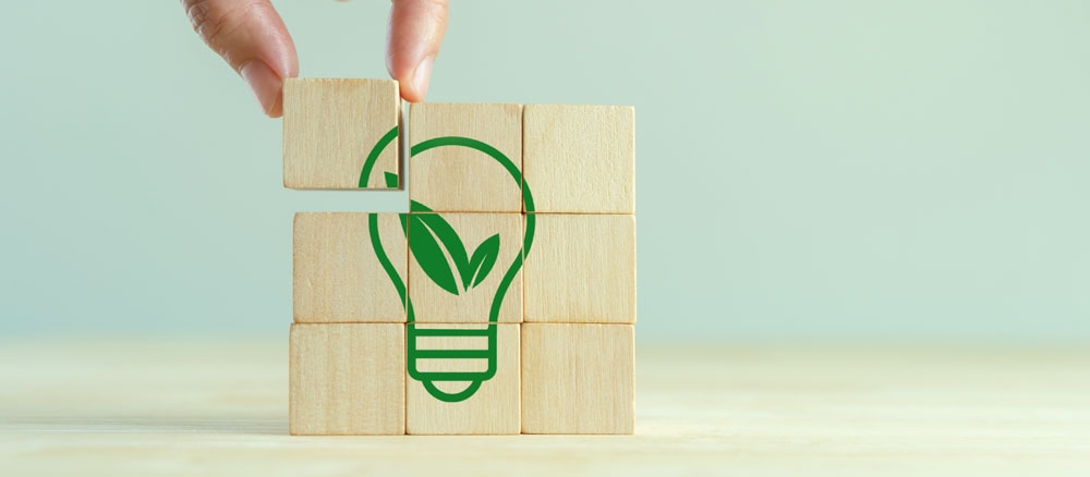 Wooden blocks with sustainable lightbulb icon printed on them