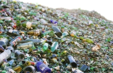 A very large pile of empty glass bottles