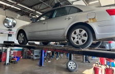 Grey car on a car lift