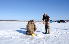 Ice fishing on a frozen Minnesota lake.