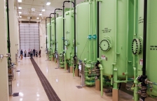 Large green water filtration tanks.