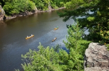Canoes on the St Croix River viewed from an overlook.