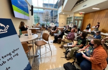 People listening to a speaker at a community meeting.