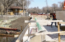 Best management practices on a construction site protect a stream bank from erosion along the route of the Southwest Green Line Light Rail Transit Extension