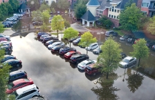 cars in standing water in a parking lot in St. Louis Park in 2019