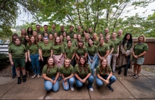 Large group of young people wearing Minnesota GreenCorps t-shirts.