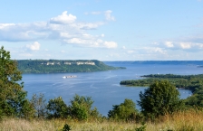 An overview of Lake Pepin with a barge in the distance, taken from a hill in Frontenac State Park.