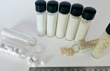 Small glass vials with varying sizes of glass beads.