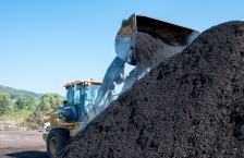 Turning compost at Resource Renew, a yard waste and food scraps composting site.