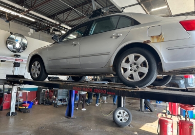 Grey car on a car lift