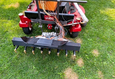 Prototype of a lawn mower attachment with steam nozzles.