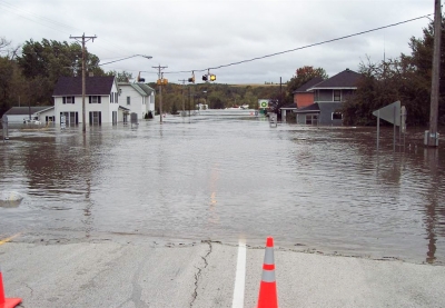 Main street of a small town completely flooded with water. 