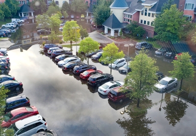 cars in standing water in a parking lot in St. Louis Park in 2019