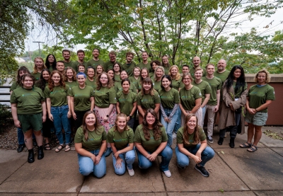 Large group of young people wearing Minnesota GreenCorps t-shirts.