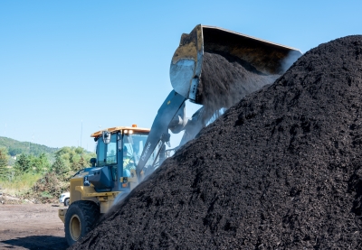 Turning compost at Resource Renew, a yard waste and food scraps composting site.