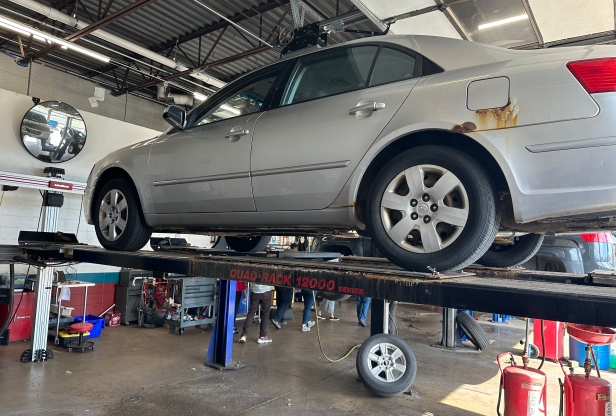 Grey car on a car lift
