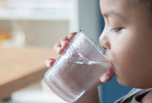 boy drinking glass of water
