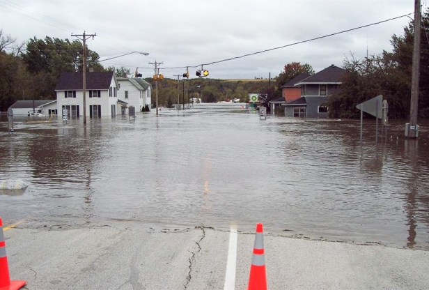 Main street of a small town completely flooded with water. 
