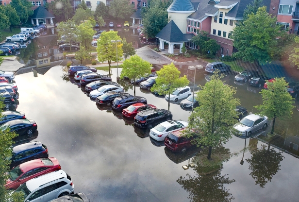 cars in standing water in a parking lot in St. Louis Park in 2019