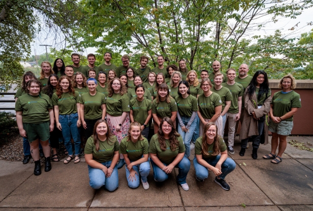 Large group of young people wearing Minnesota GreenCorps t-shirts.