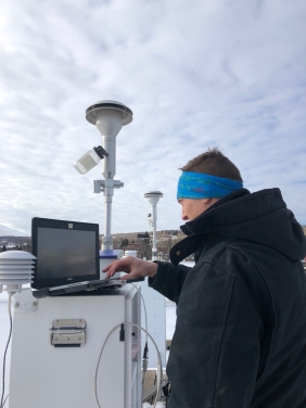 An MPCA air quality specialist checks on air monitoring equipment.