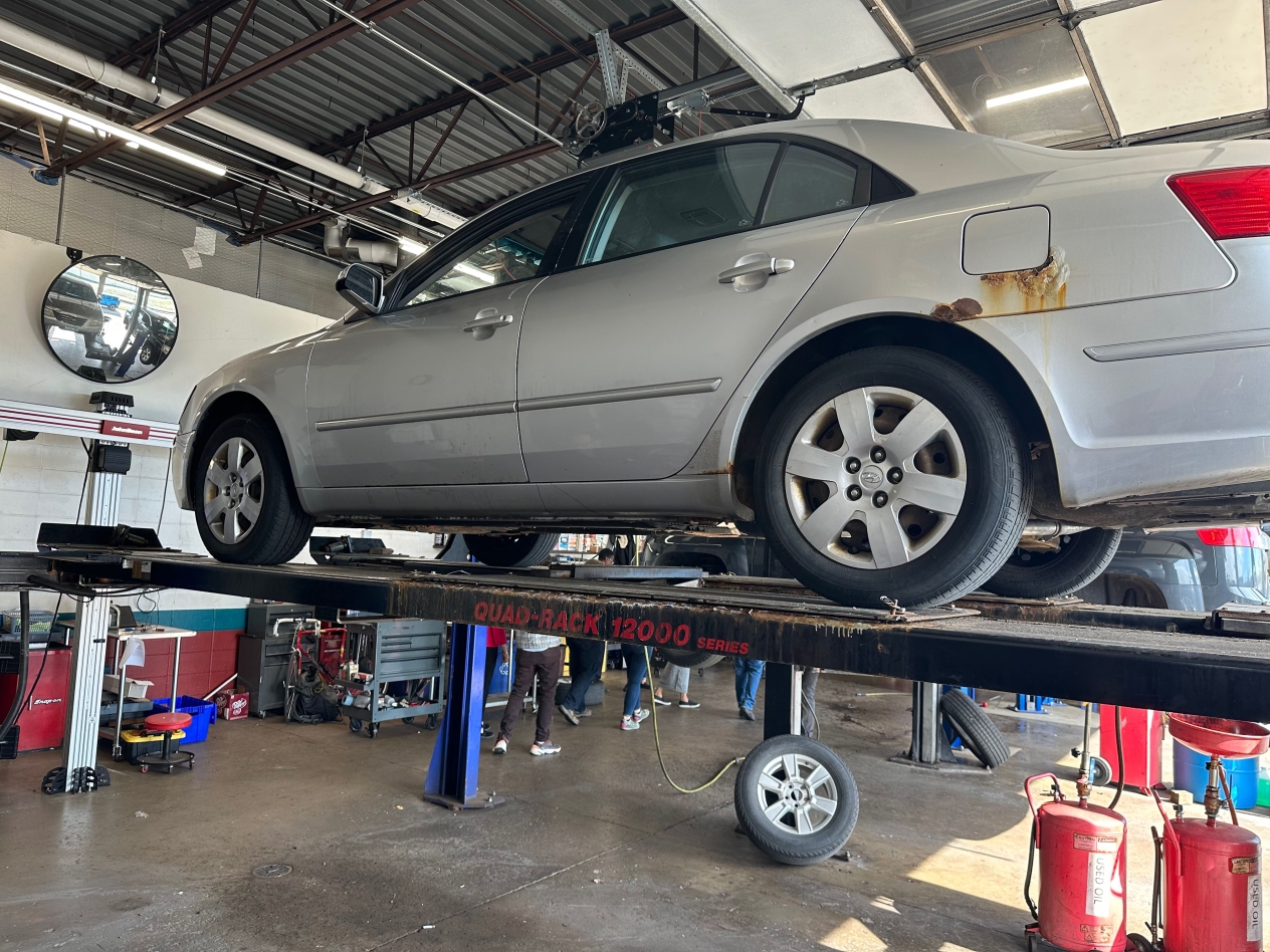 Grey car on a car lift