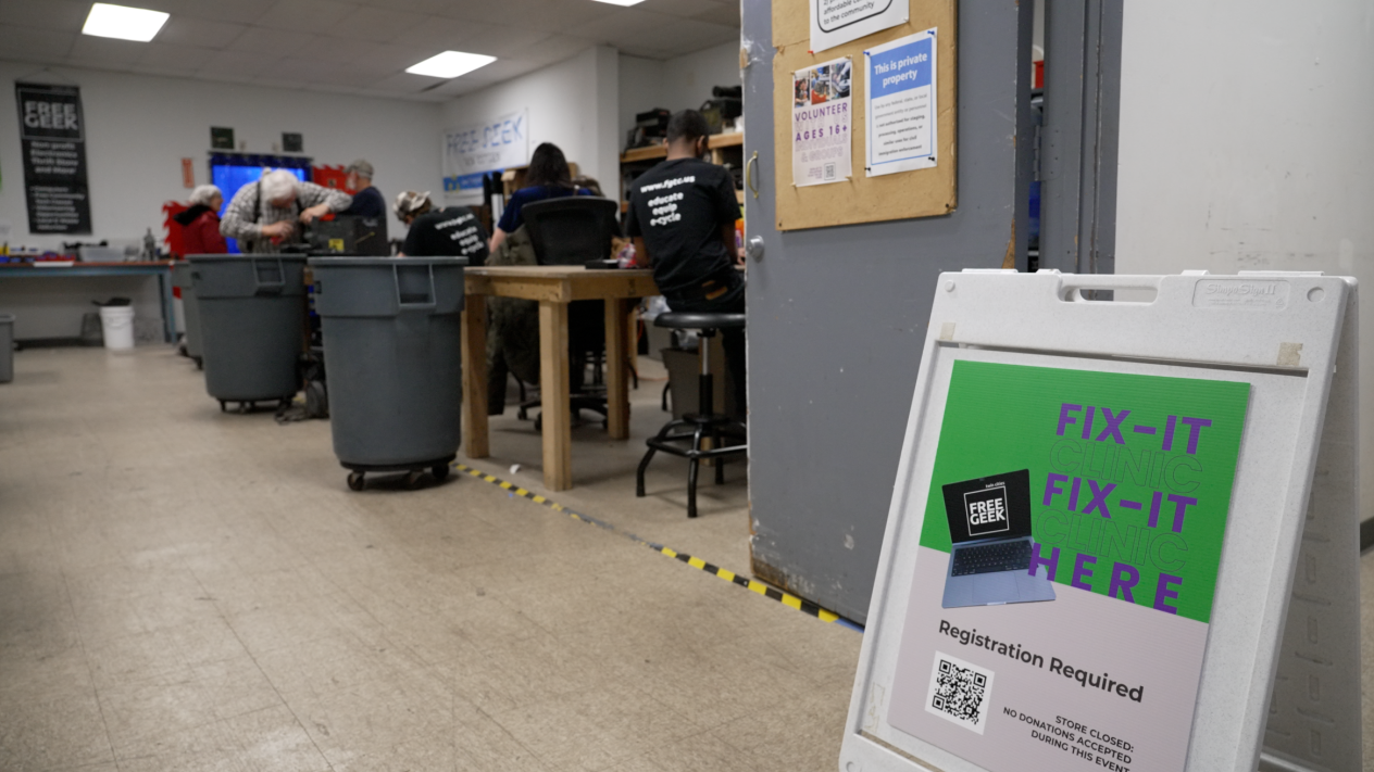 Registration sign outside an electronics fix-it clinic at Free Geek in Minneapolis
