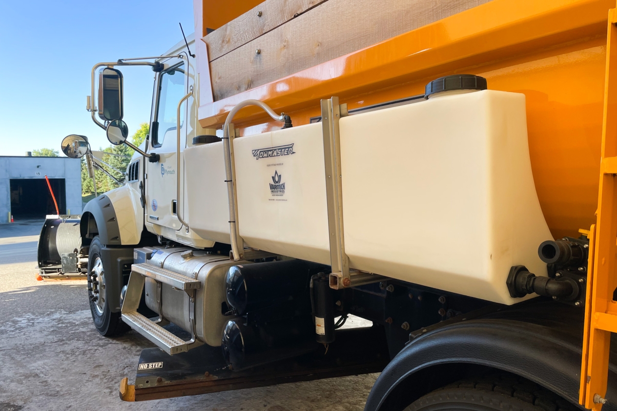 brine tank mounted to the side of a Plymouth plow truck