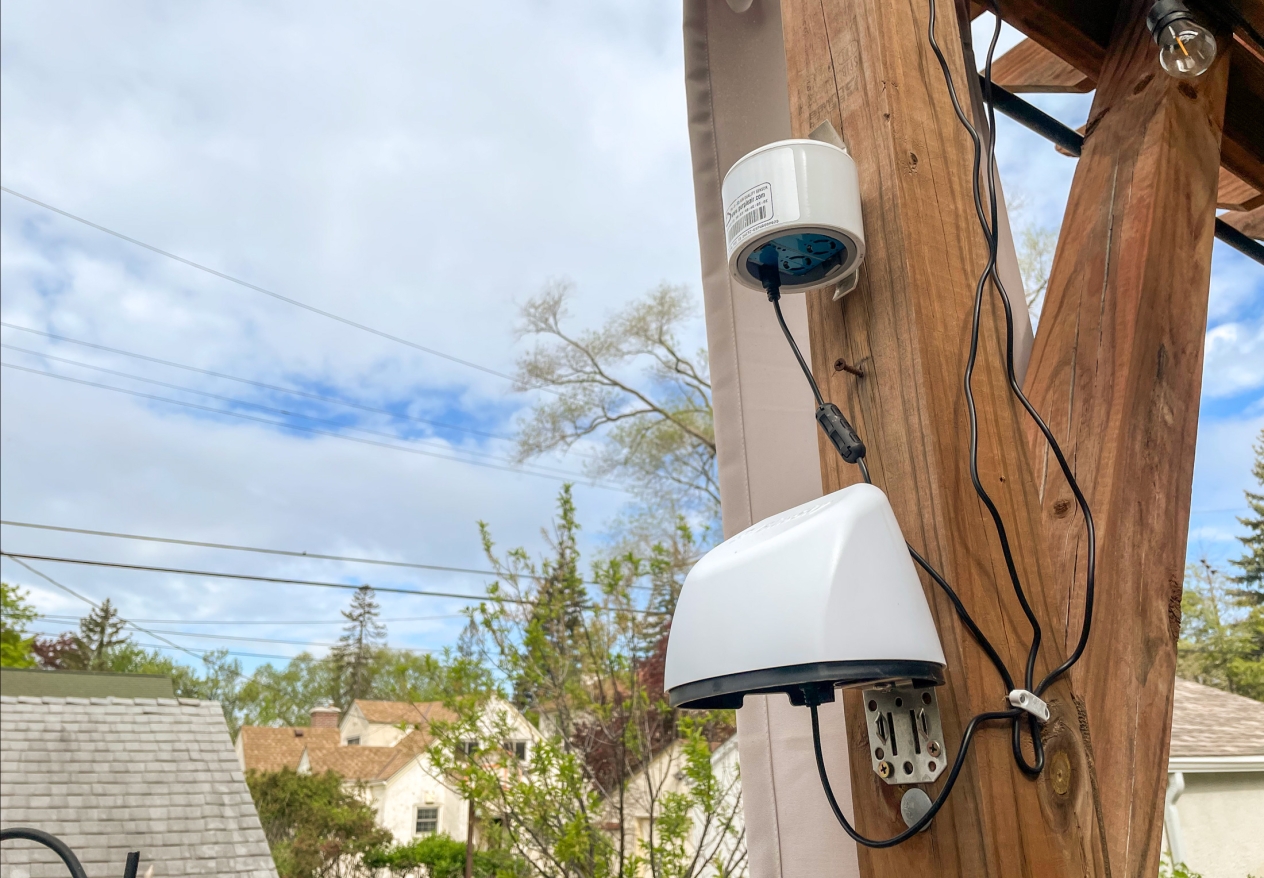 Air monitoring equipment attached to a wood beam.
