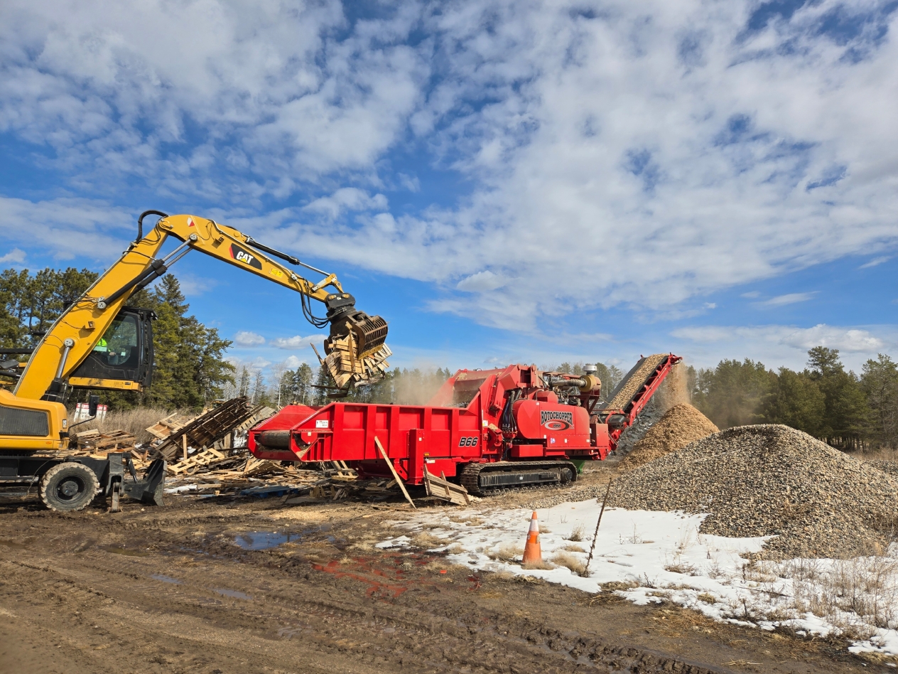 A horizontal grinder is a heavy-duty industrial machine designed to grind and cut wood and other organic materials