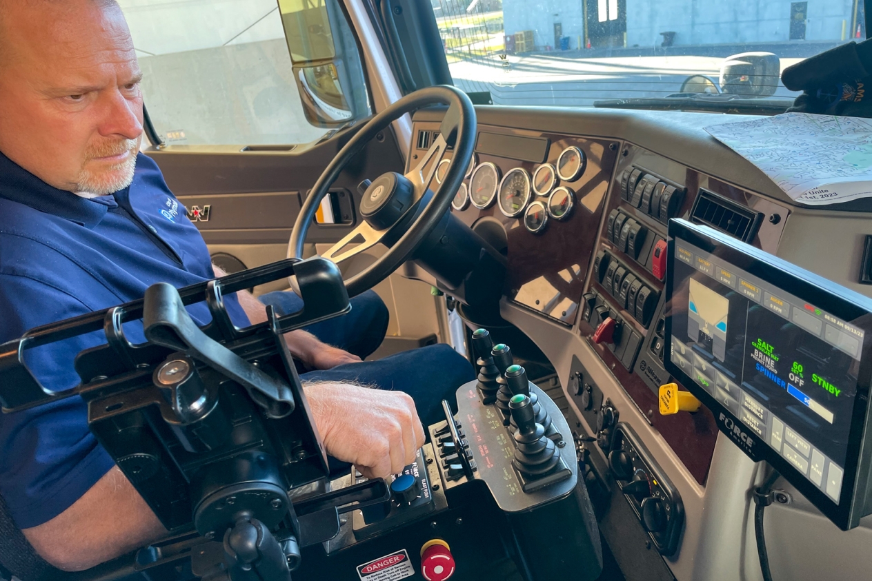 Plymouth street supervisor Torrey Keith in the cab of a Plymouth plow truck