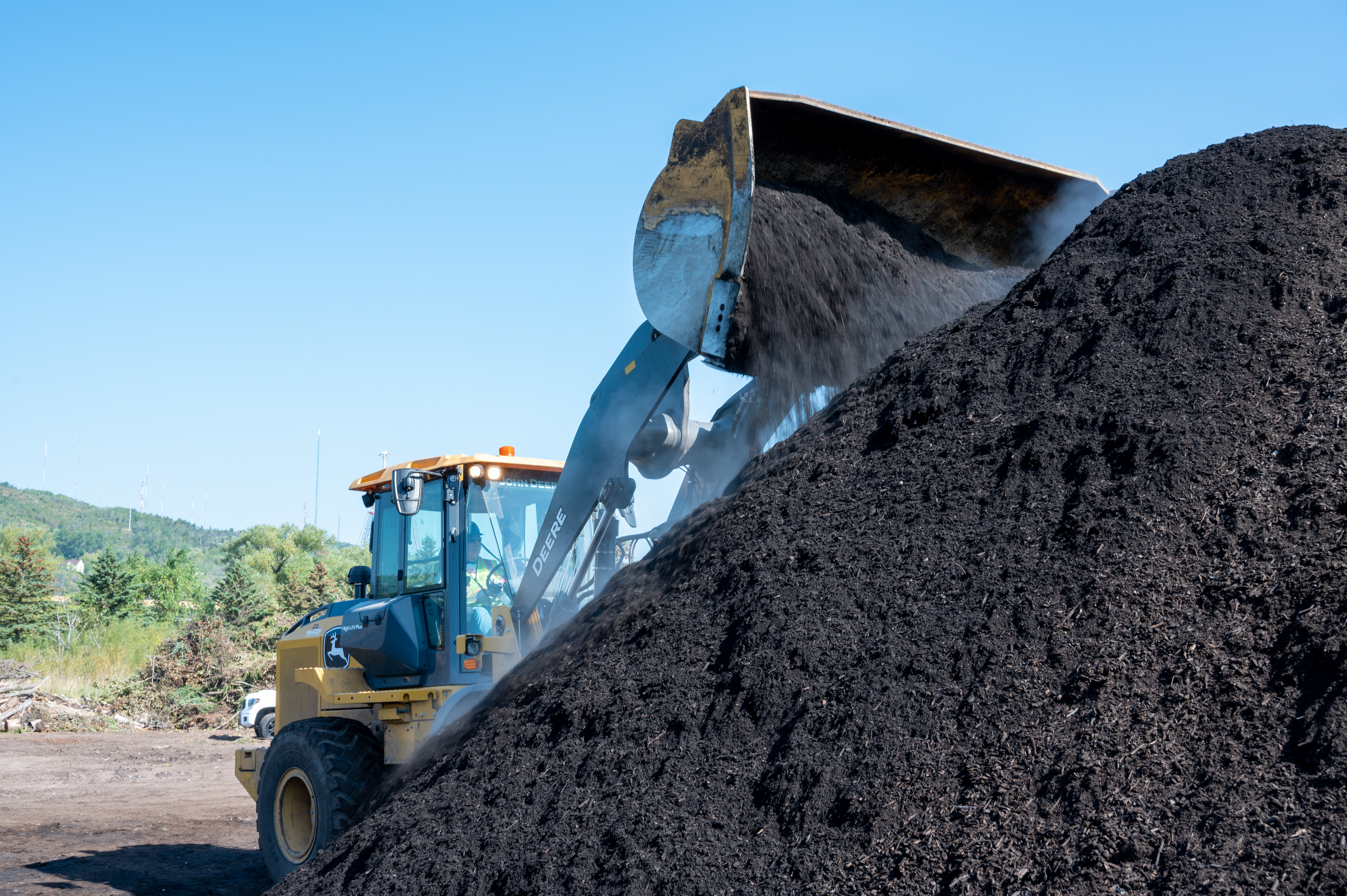 Turning compost at Resource Renew, a yard waste and food scraps composting site.